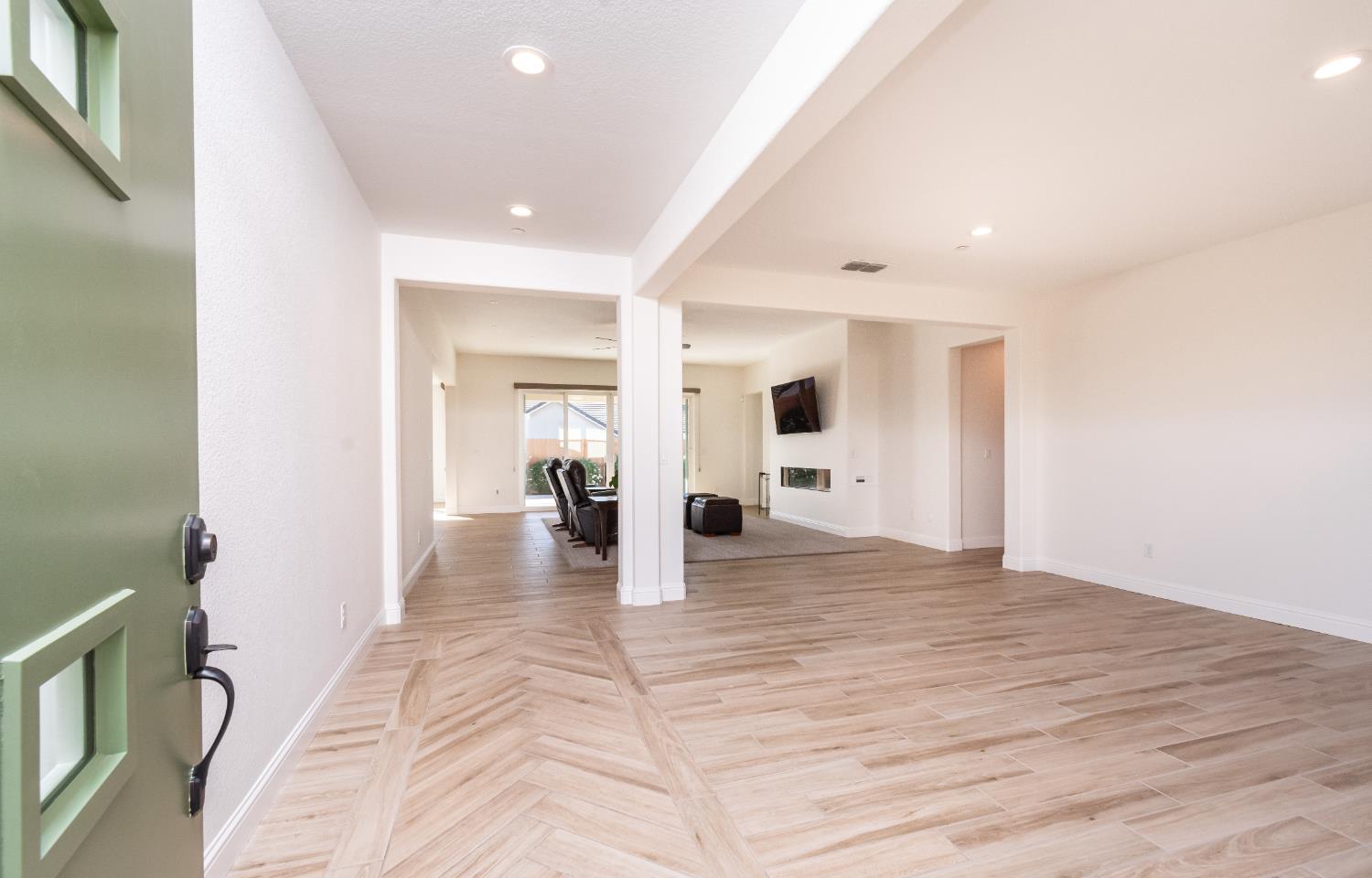 124 Basile Court Lincoln, CA 95648 - Photo 25 of 64 a view of a hallway with wooden floor and a bathroom
