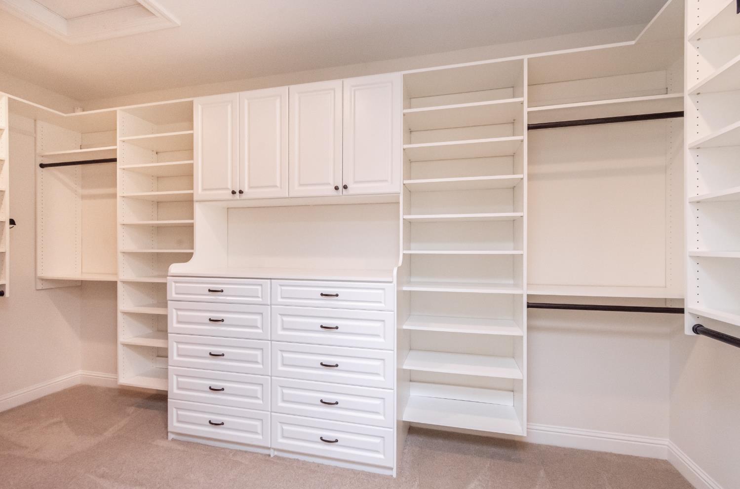124 Basile Court Lincoln, CA 95648 - Photo 25 of 55 walk in closet featuring light carpet and attic access