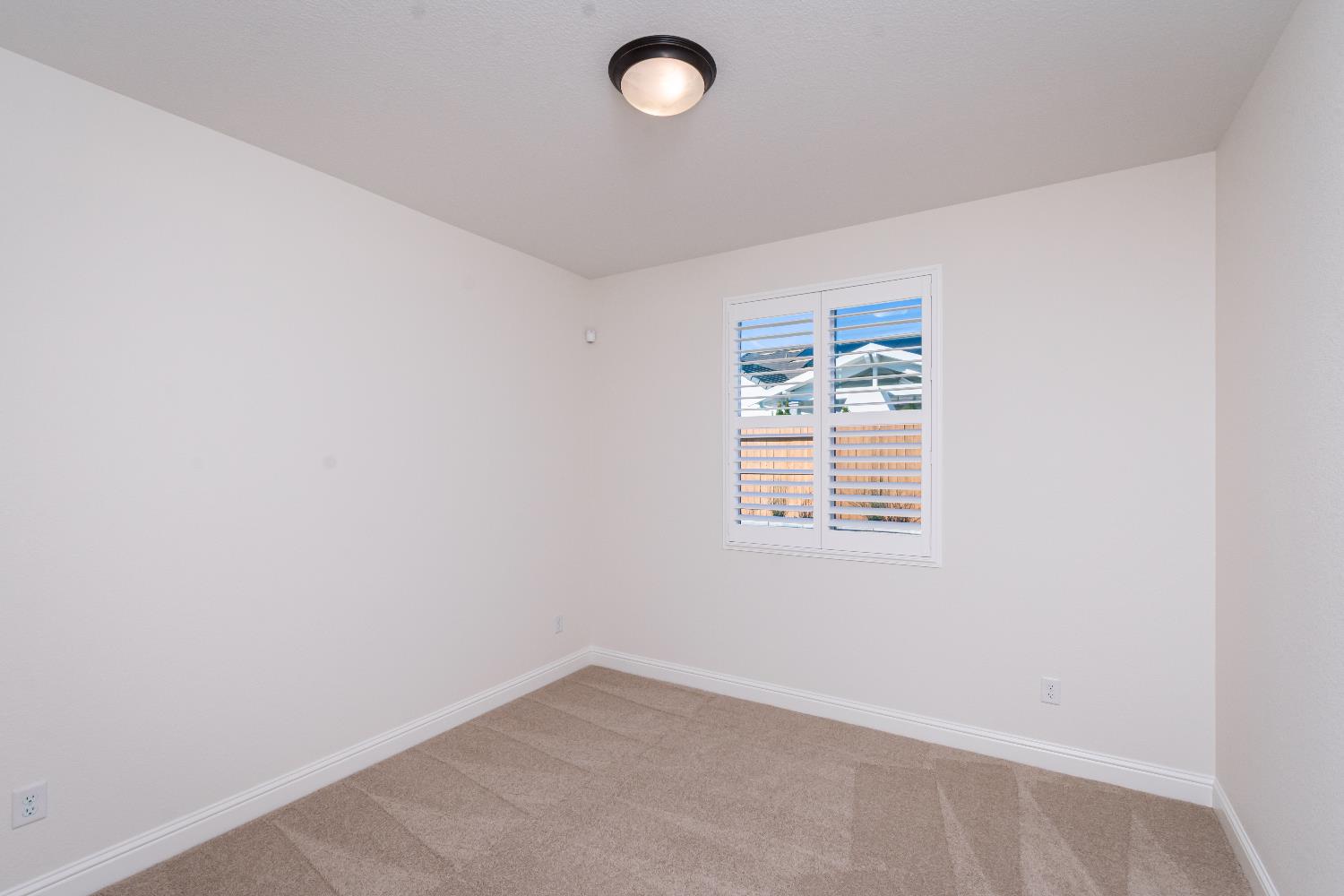 124 Basile Court Lincoln, CA 95648 - Photo 30 of 55 unfurnished room featuring light colored carpet and baseboards