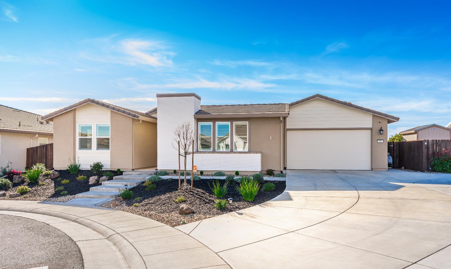124 Basile Court Lincoln, CA 95648 - Photo 3 of 55 ranch-style home featuring an attached garage, driveway, stucco siding, and a tile roof