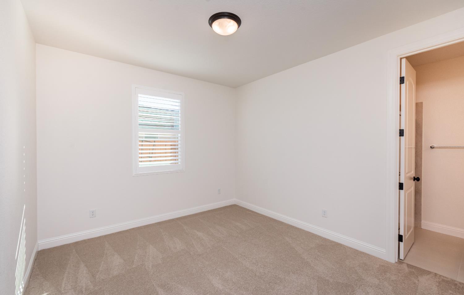 124 Basile Court Lincoln, CA 95648 - Photo 31 of 55 unfurnished room featuring light colored carpet and baseboards