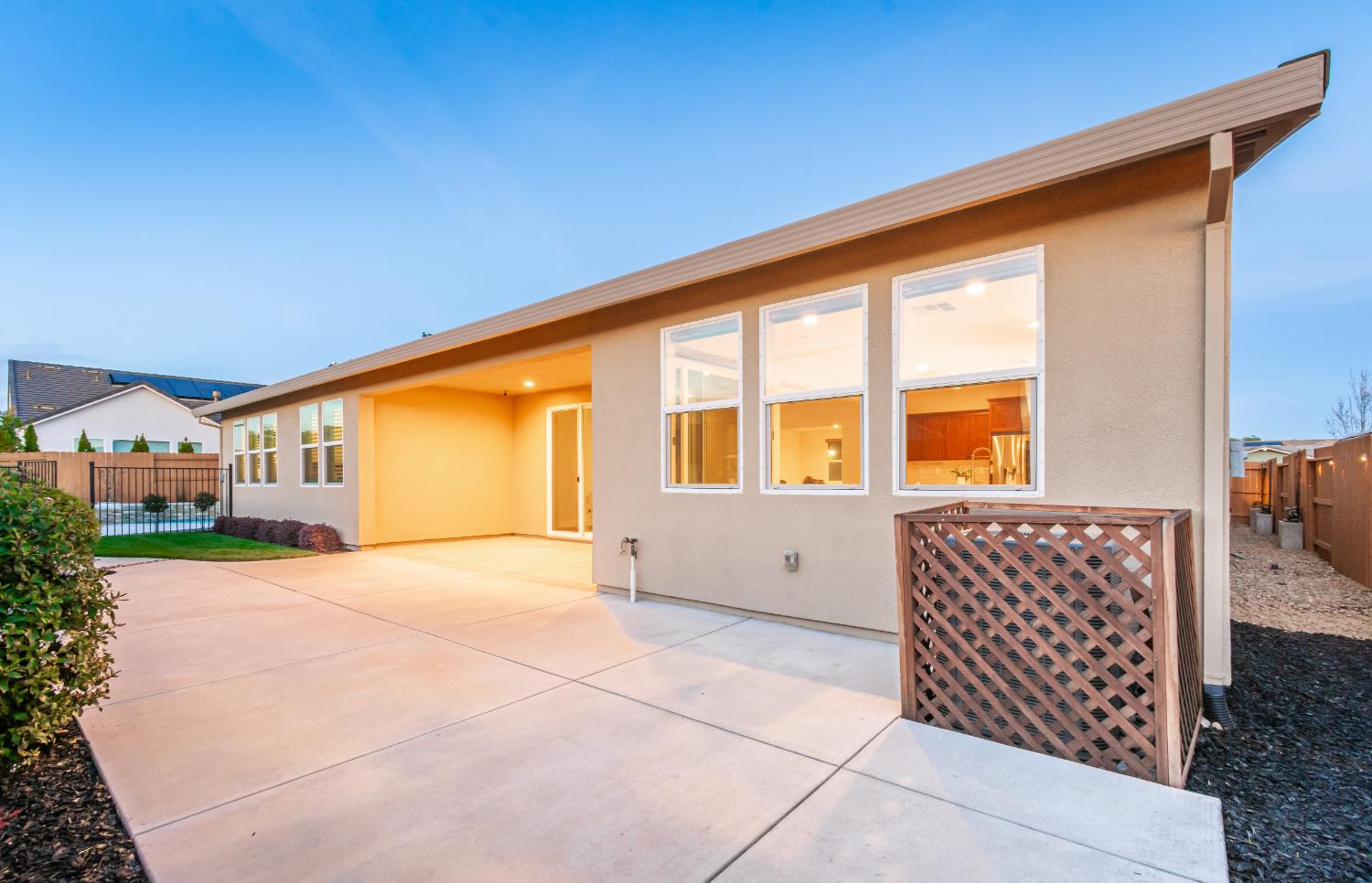 124 Basile Court Lincoln, CA 95648 - Photo 37 of 55 back of house featuring stucco siding and a patio