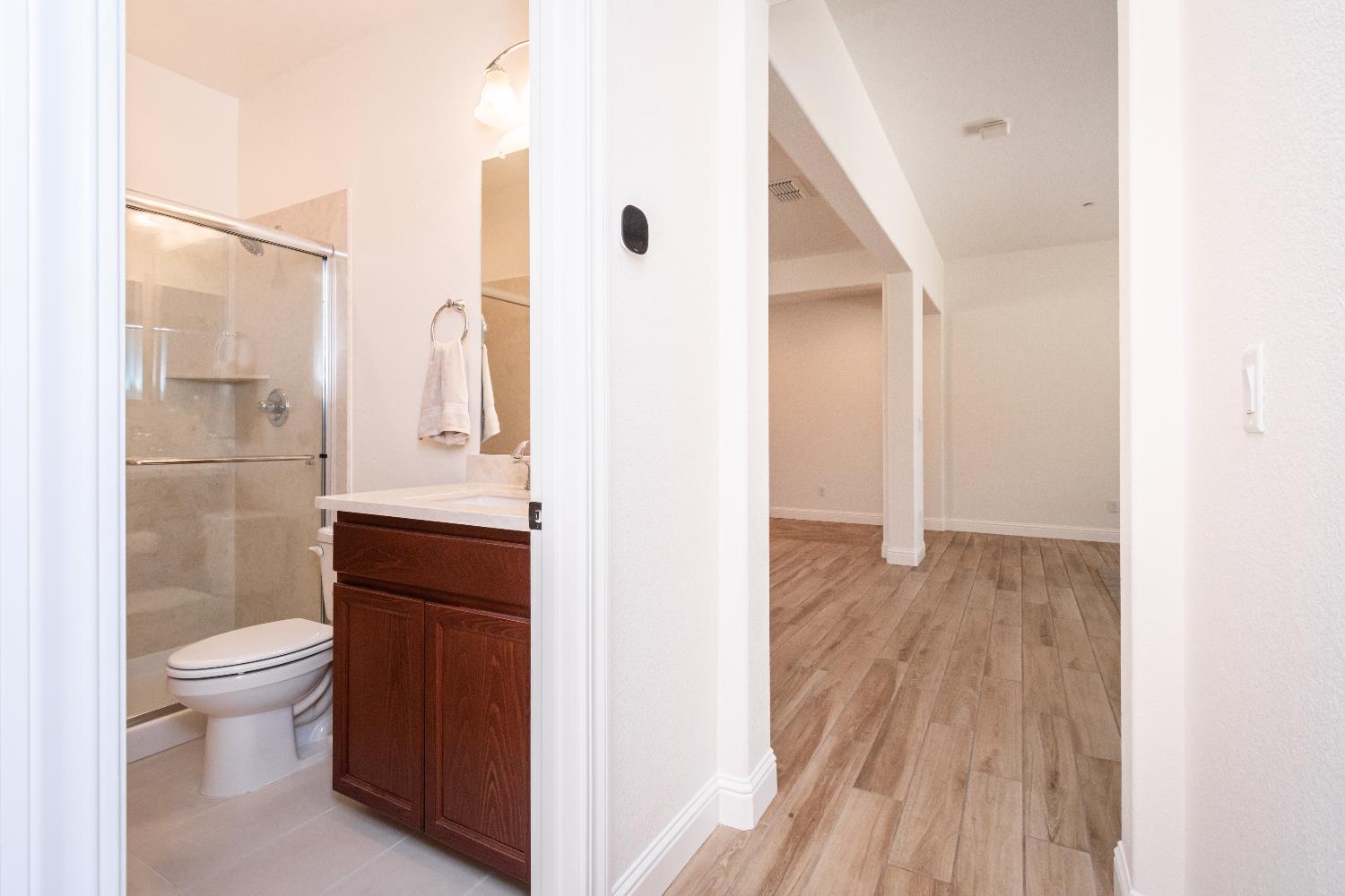 124 Basile Court Lincoln, CA 95648 - Photo 41 of 64 a bathroom with a sink a toilet and shower