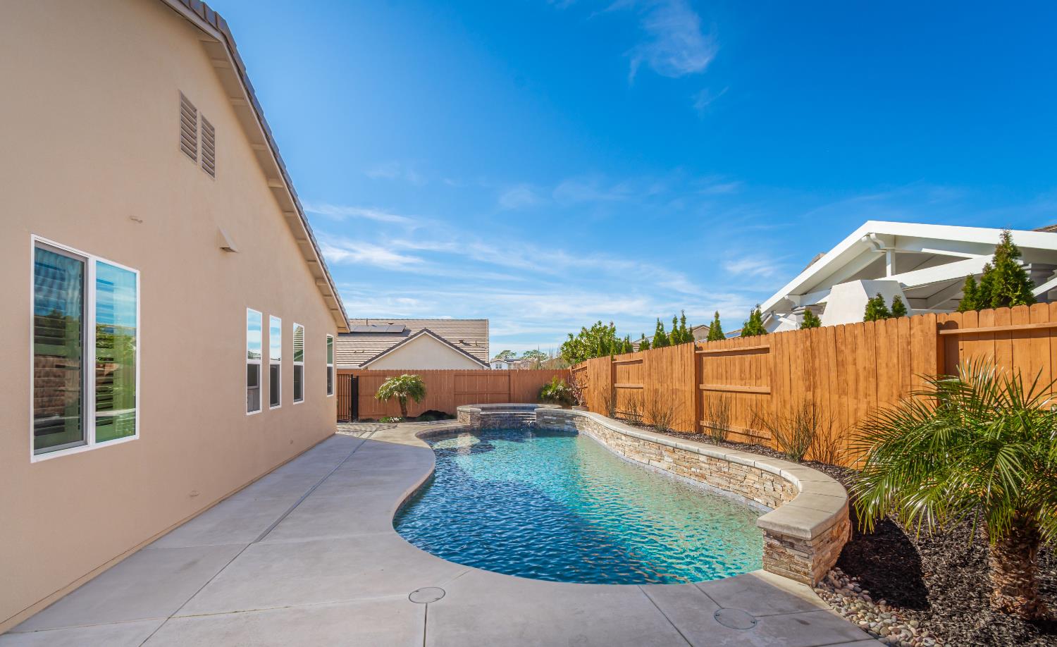 124 Basile Court Lincoln, CA 95648 - Photo 44 of 55 combined pool / hot tub with a patio and a fenced backyard