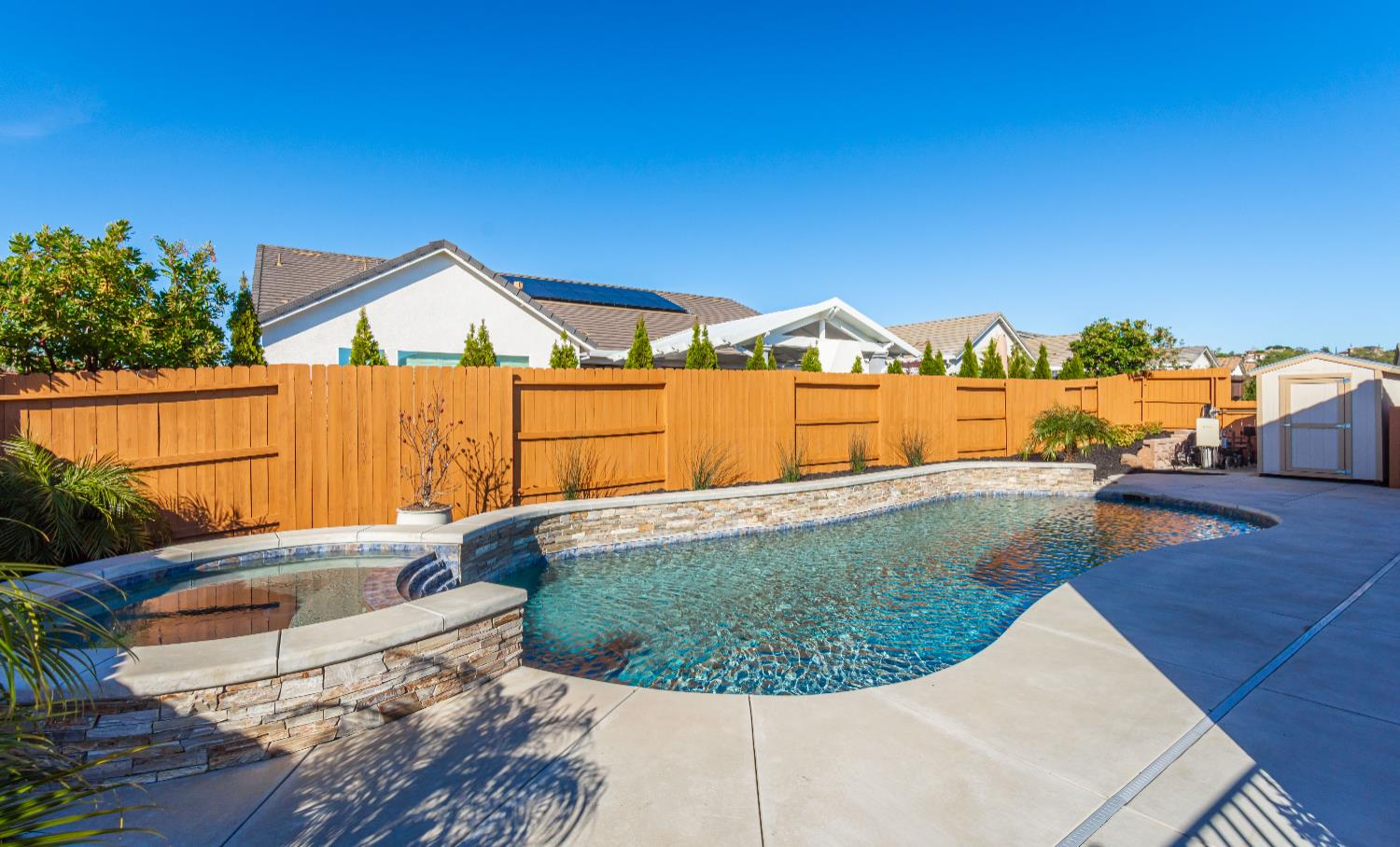 124 Basile Court Lincoln, CA 95648 - Photo 45 of 55 integrated pool / spa with a shed, a fenced backyard, and a patio area