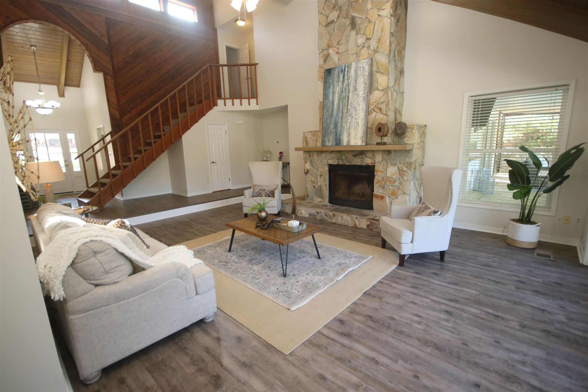 5425 Rowe Trail Pace, FL 32571 - Photo 11 of 50 a living room with furniture and a fireplace