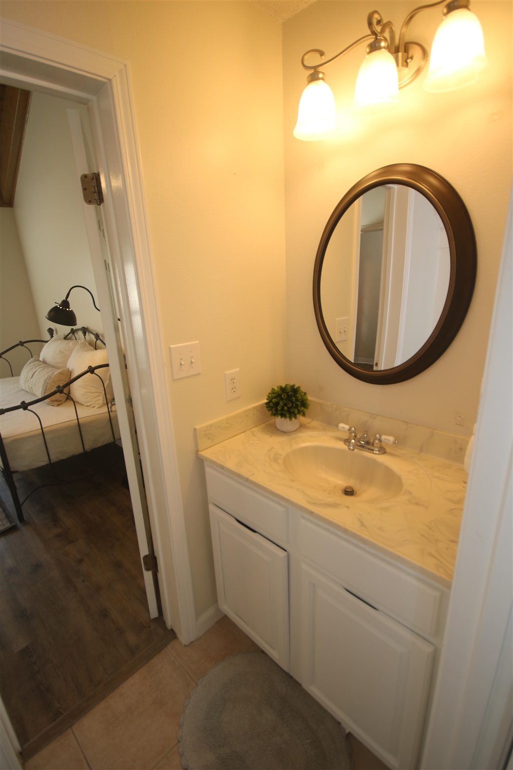 5425 Rowe Trail Pace, FL 32571 - Photo 17 of 50 a bathroom with a sink and a mirror
