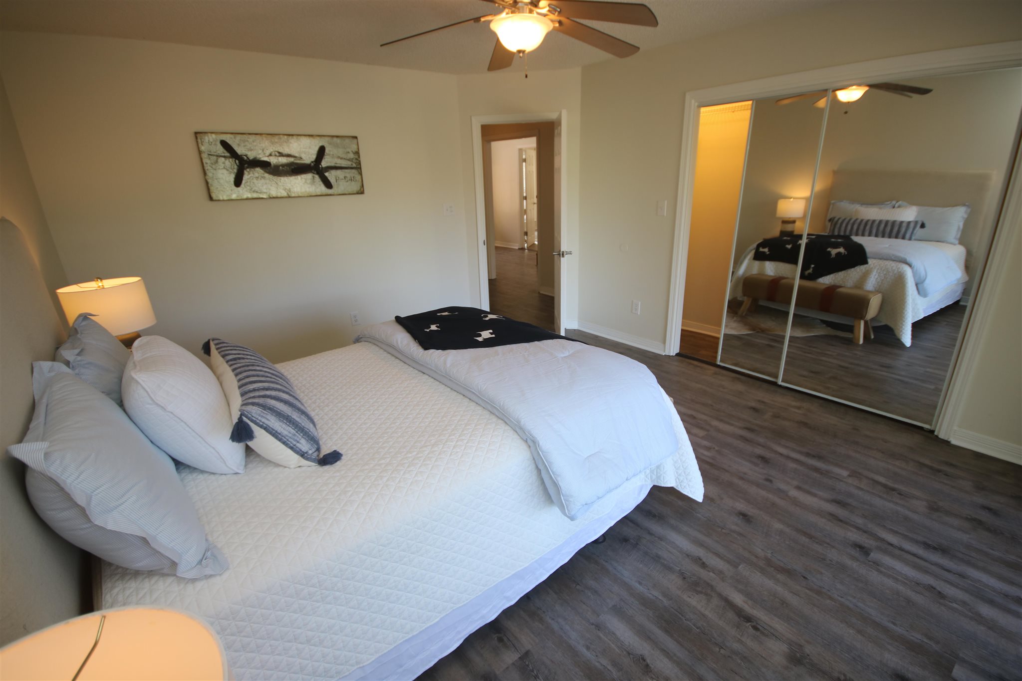 5425 Rowe Trail Pace, FL 32571 - Photo 20 of 50 a bedroom with a bed and a chandelier