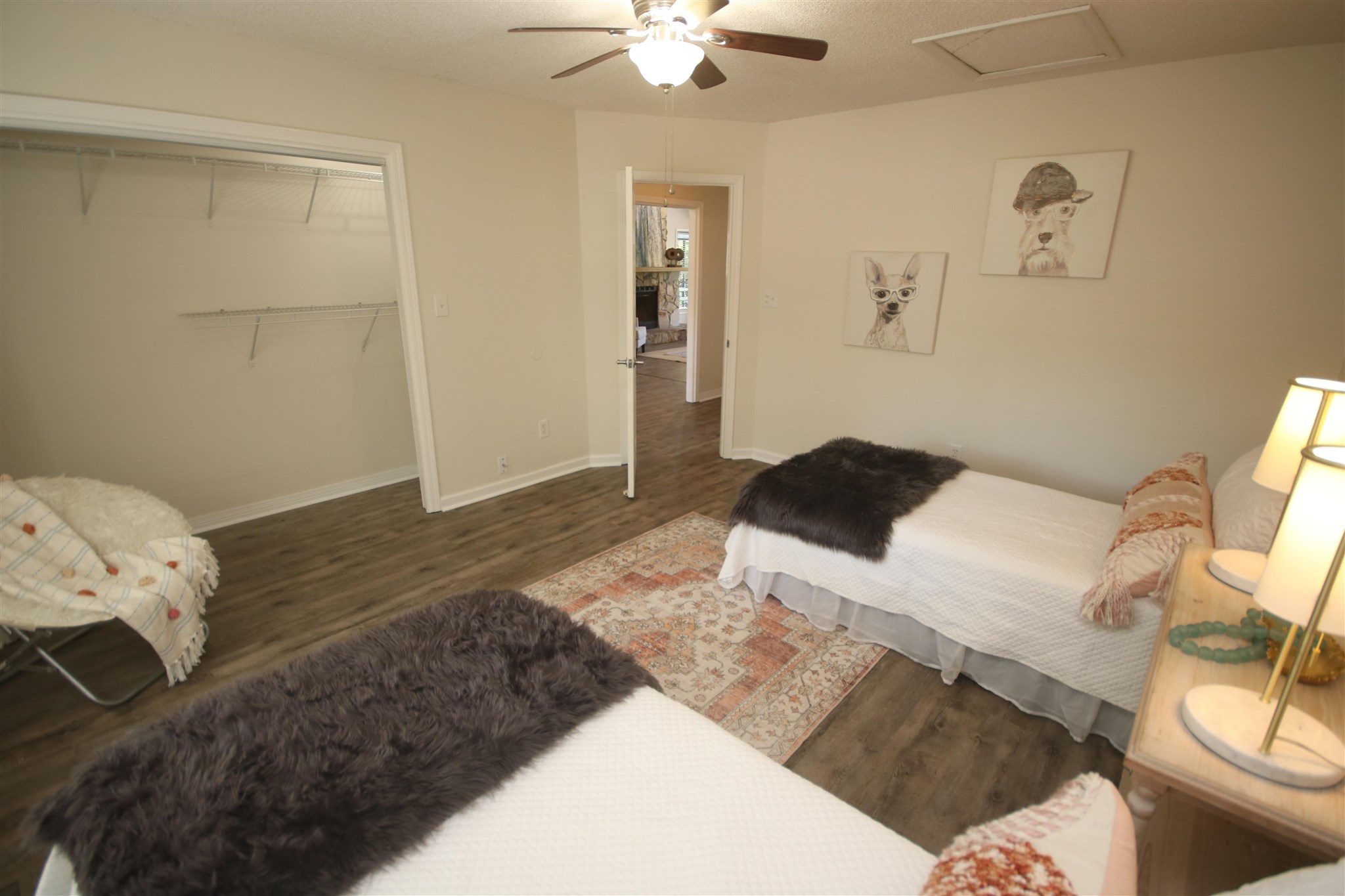 5425 Rowe Trail Pace, FL 32571 - Photo 25 of 50 a bedroom with a bed and a chandelier