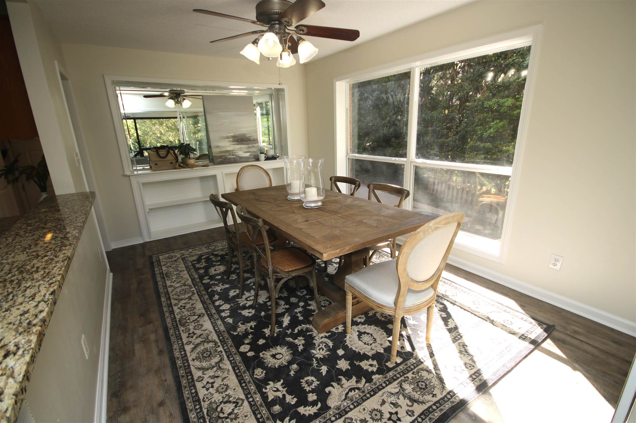 5425 Rowe Trail Pace, FL 32571 - Photo 33 of 50 a view of a dining room with furniture window and wooden floor