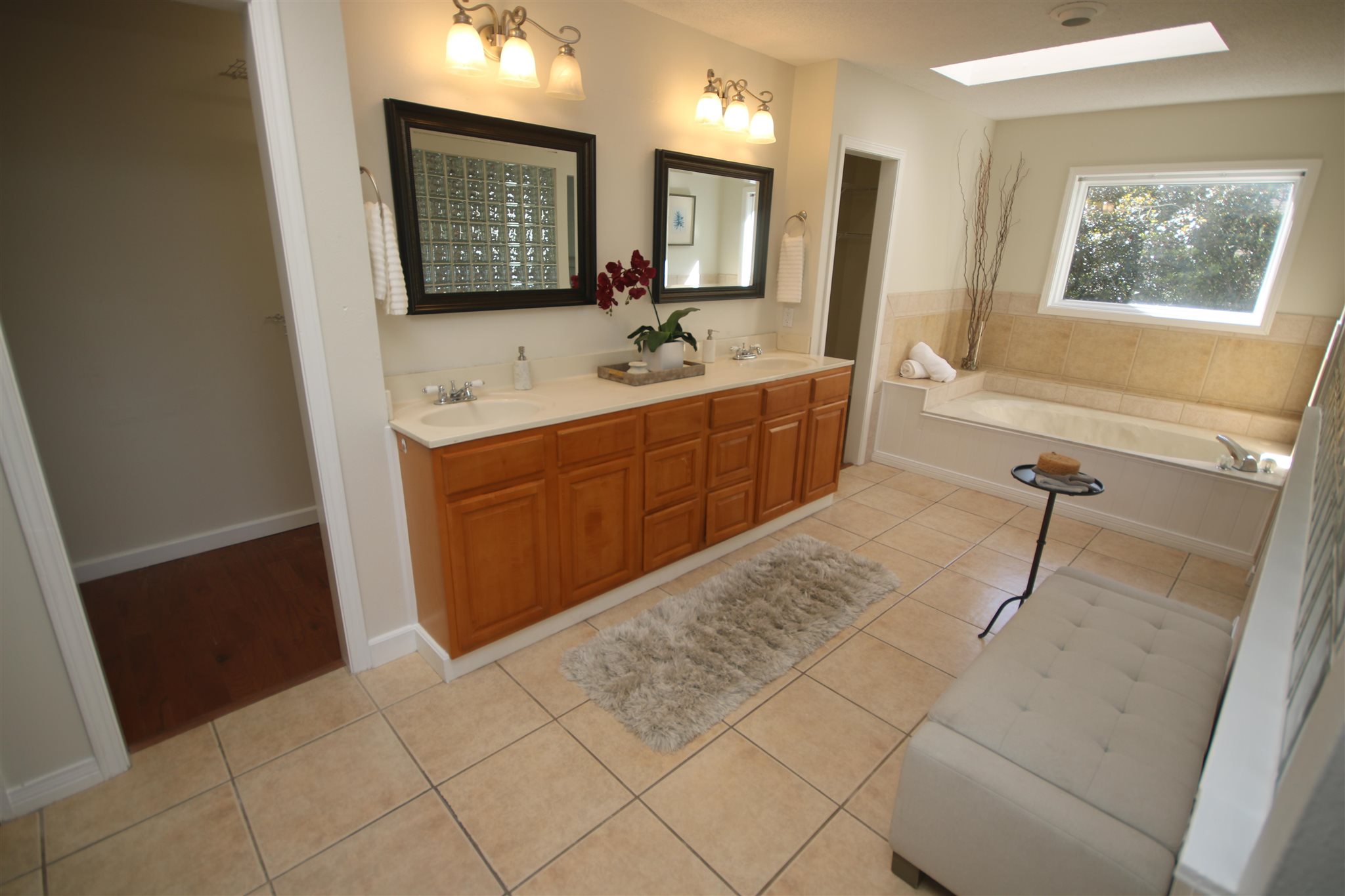 5425 Rowe Trail Pace, FL 32571 - Photo 38 of 50 a bathroom with a sink a mirror and a bathtub