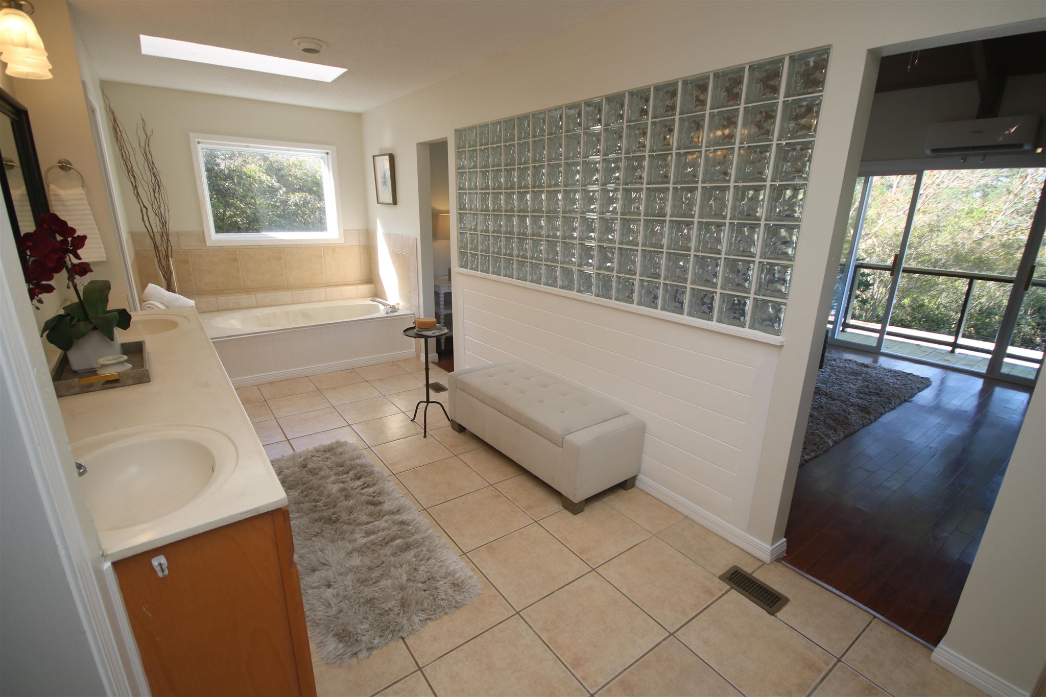 5425 Rowe Trail Pace, FL 32571 - Photo 40 of 50 a bathroom with a tub sink and window