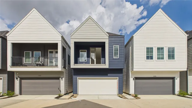 a front view of a house with a garage