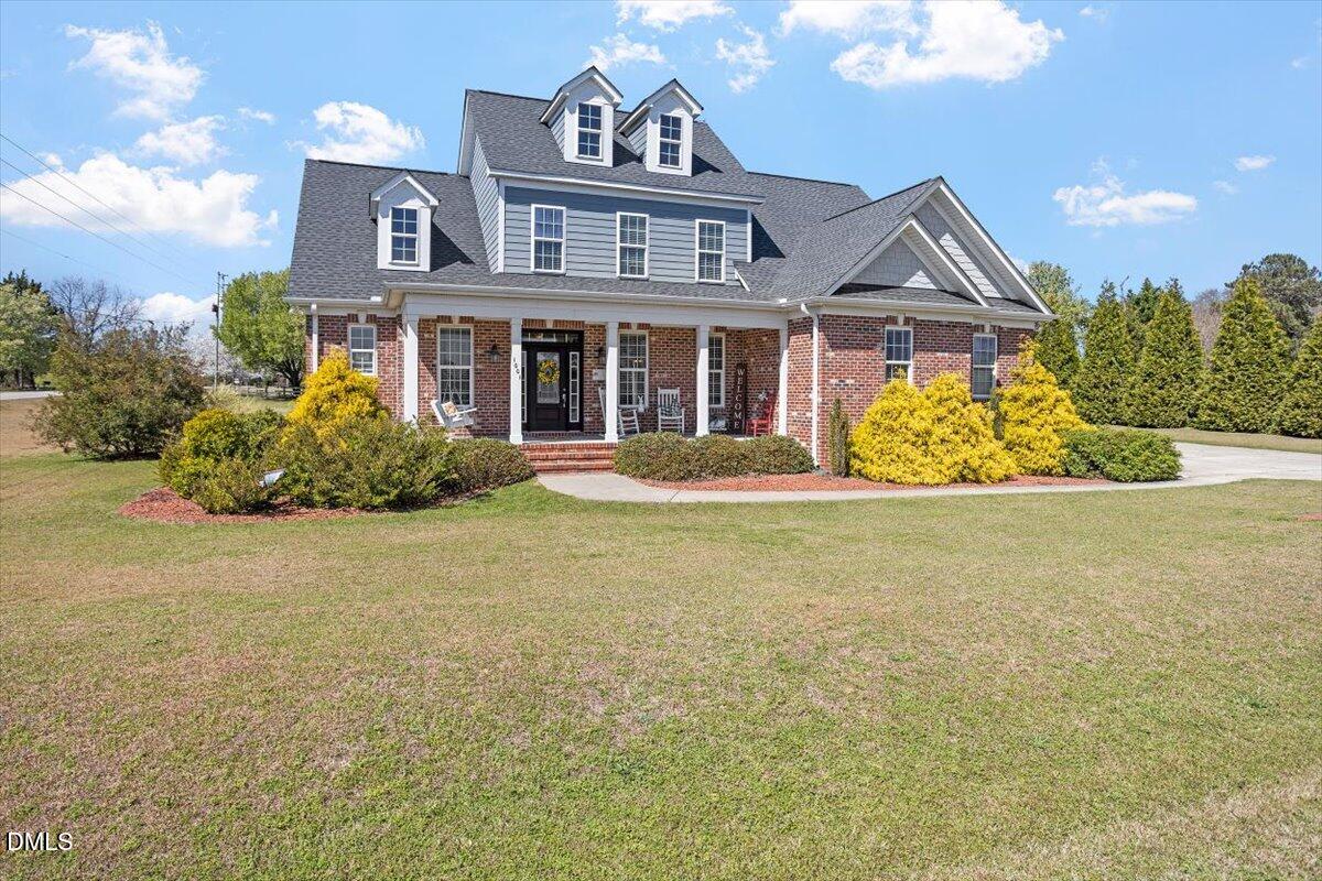 1001 Bellewood Farms Road Raleigh, NC 27603 - Photo 2 of 39 a front view of a house with garden