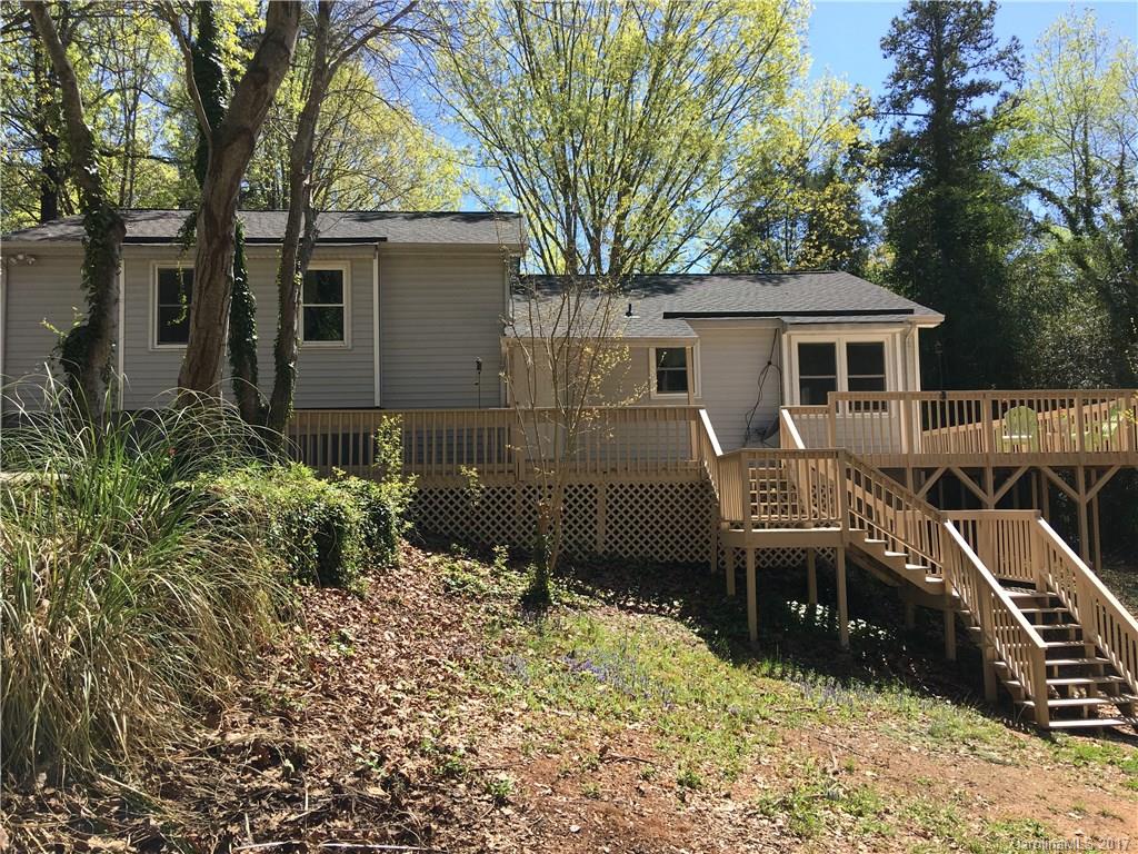 3085 Point Clear Drive Tega Cay, SC 29708 - Photo 1 of 21 a view of a house with backyard and trees