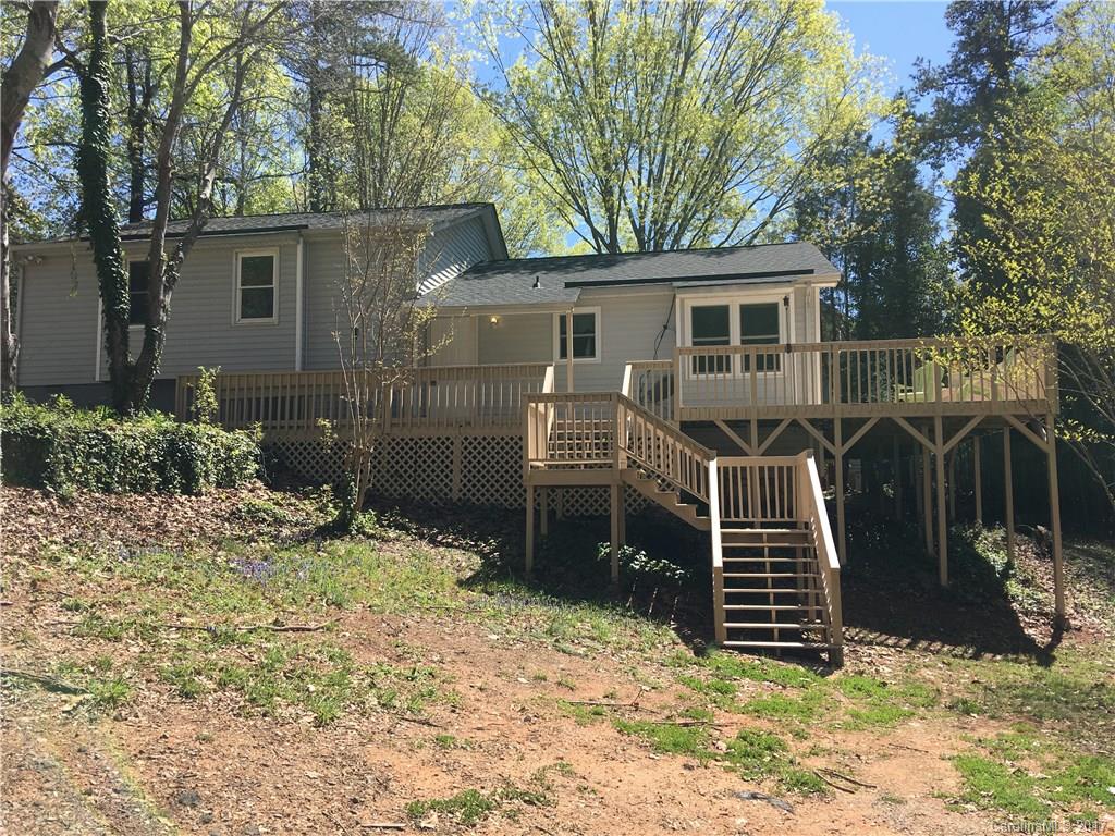 3085 Point Clear Drive Tega Cay, SC 29708 - Photo 2 of 21 a view of a house with large windows and a yard