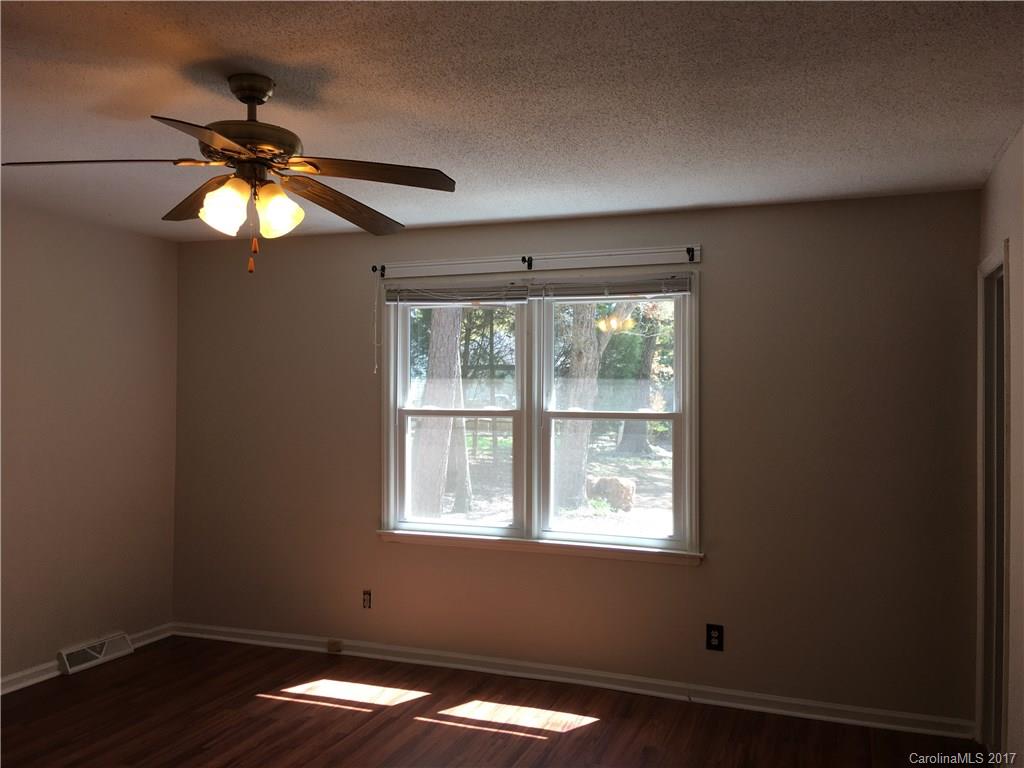 3085 Point Clear Drive Tega Cay, SC 29708 - Photo 14 of 21 a view of a chandelier fan and a window in a room