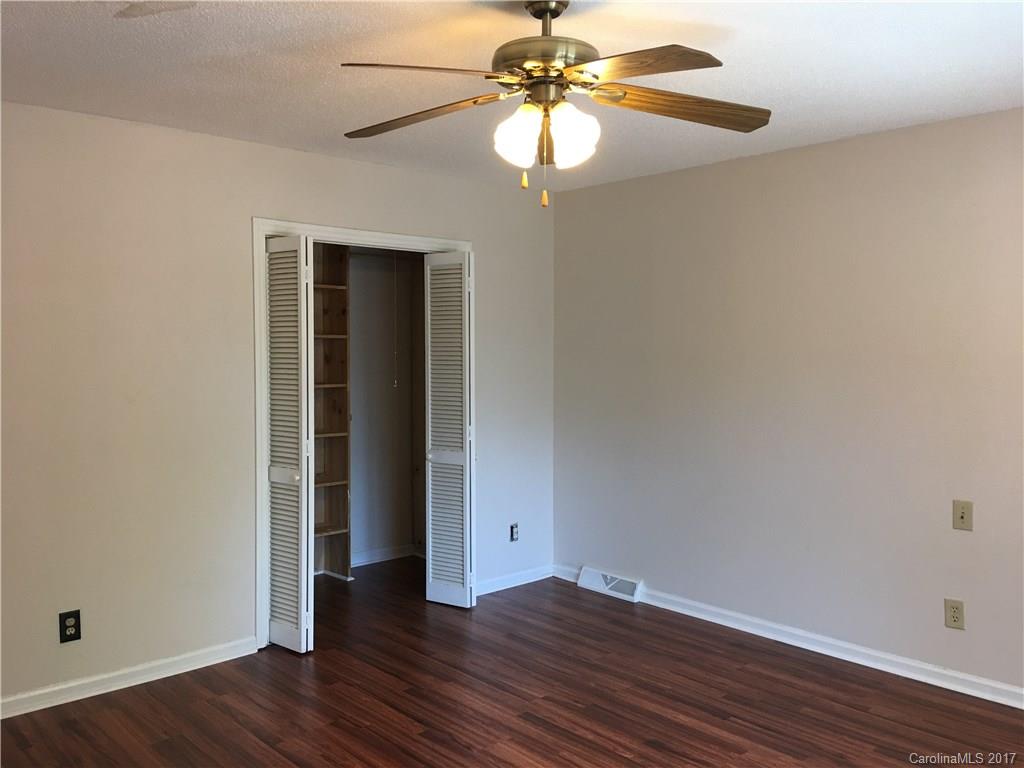 3085 Point Clear Drive Tega Cay, SC 29708 - Photo 15 of 21 a view of an empty room with wooden floor