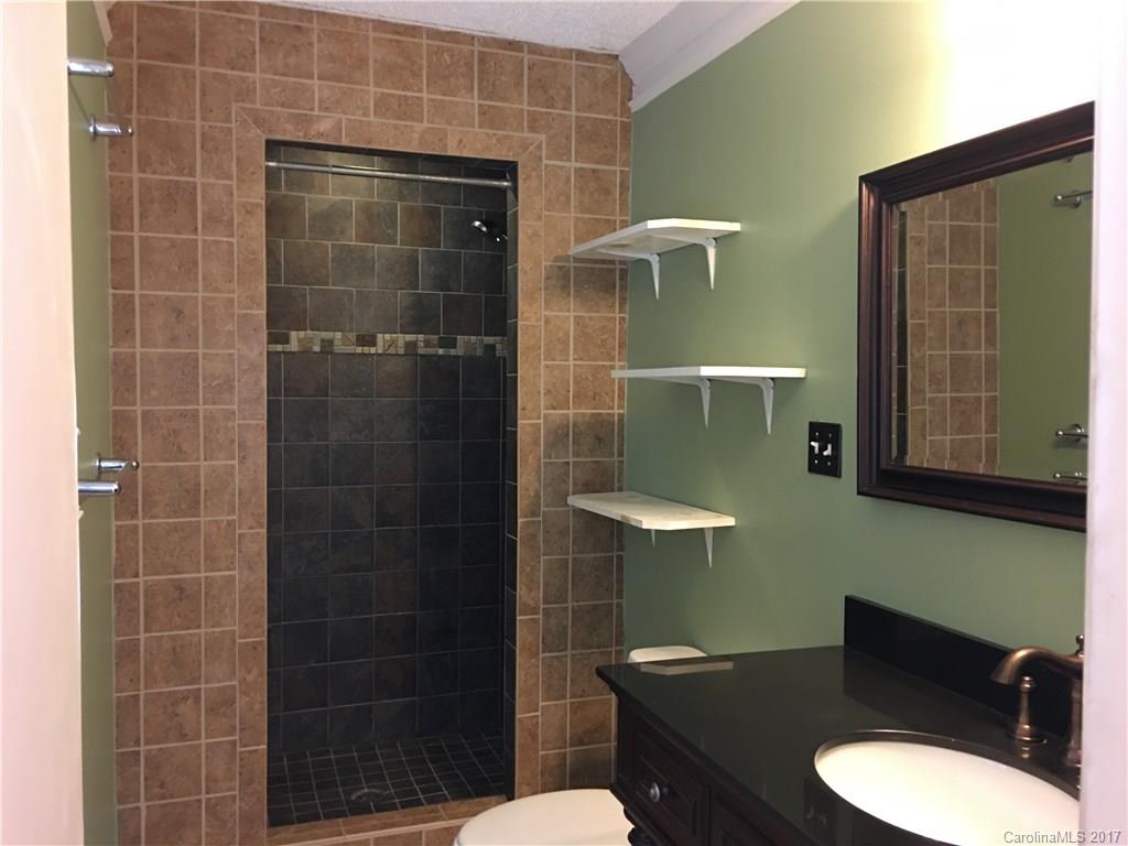 3085 Point Clear Drive Tega Cay, SC 29708 - Photo 16 of 21 a bathroom with a sink toilet and shower