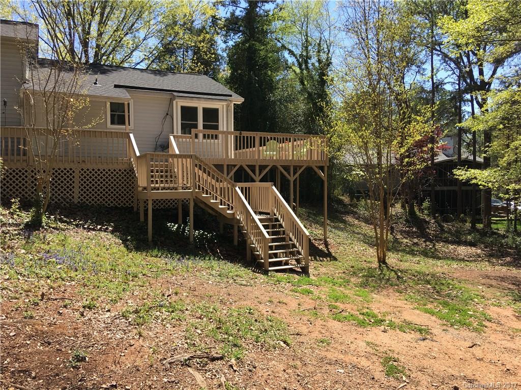 3085 Point Clear Drive Tega Cay, SC 29708 - Photo 17 of 21 a view of a house with a yard and large trees