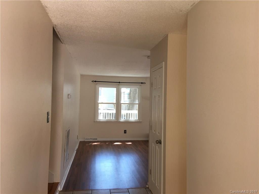 3085 Point Clear Drive Tega Cay, SC 29708 - Photo 3 of 21 an empty room with wooden floor and windows