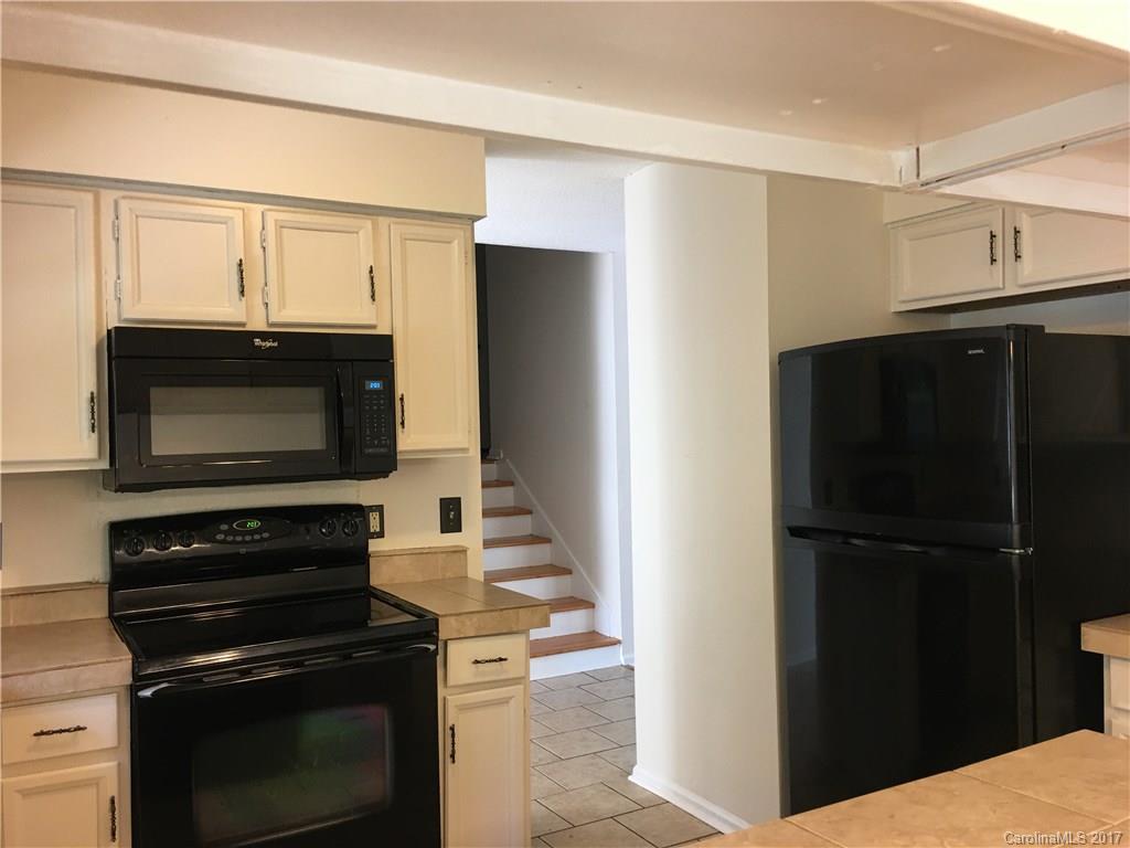 3085 Point Clear Drive Tega Cay, SC 29708 - Photo 8 of 21 a kitchen with a refrigerator stove and microwave