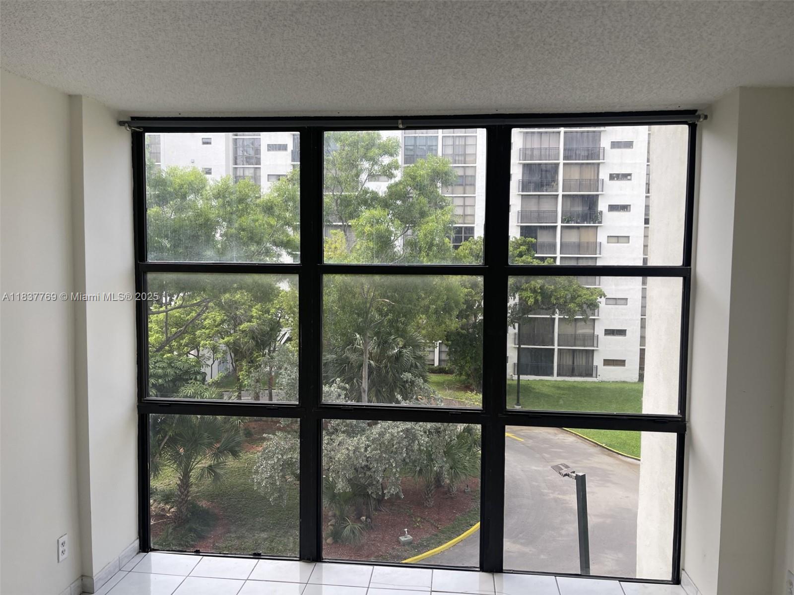 17011 North Bay Road, Unit 406 Sunny Isles Beach, FL 33160 - Photo 7 of 12 a view of a glass door with a window