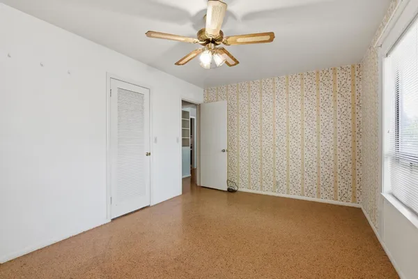 a view of a bathroom with white door