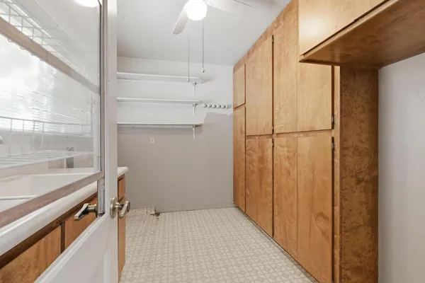 a kitchen with a sink counter top space and stainless steel appliances