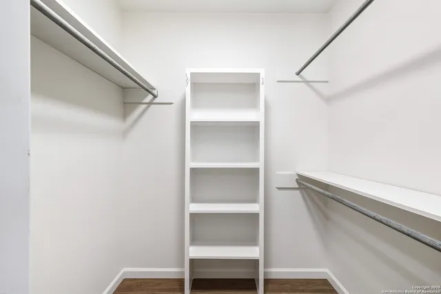a view of an empty walk in closet