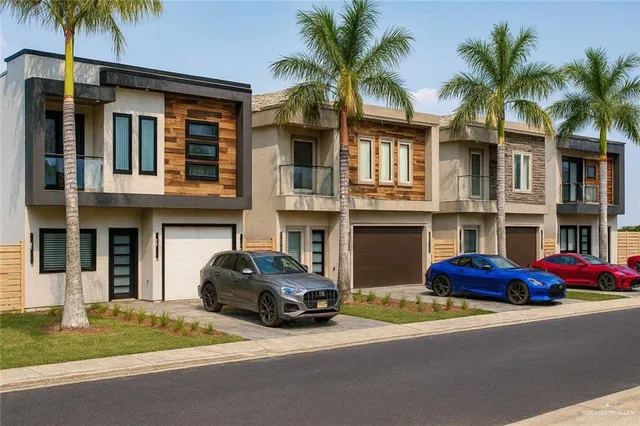 a couple of cars parked in front of a building
