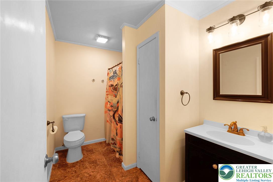 256 Sundance Road Effort, PA 18330 - Photo 64 of 83 a bathroom with a toilet sink and mirror