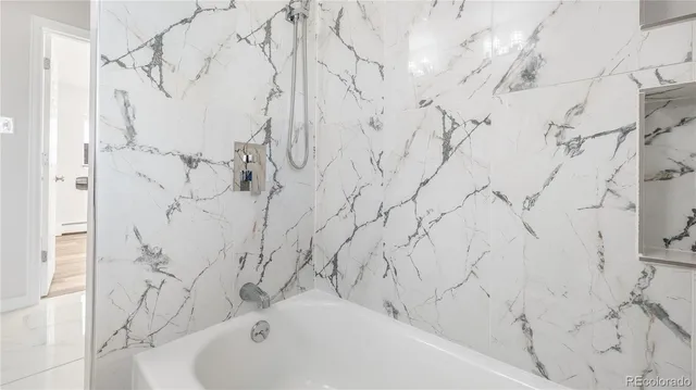 a bed room with a bed and a wall painting