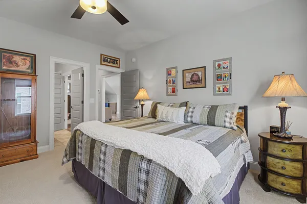 a bed room with a bed and a lamp