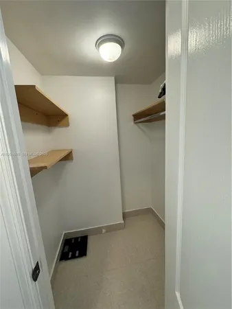 a bathroom with a sink toilet and mirror