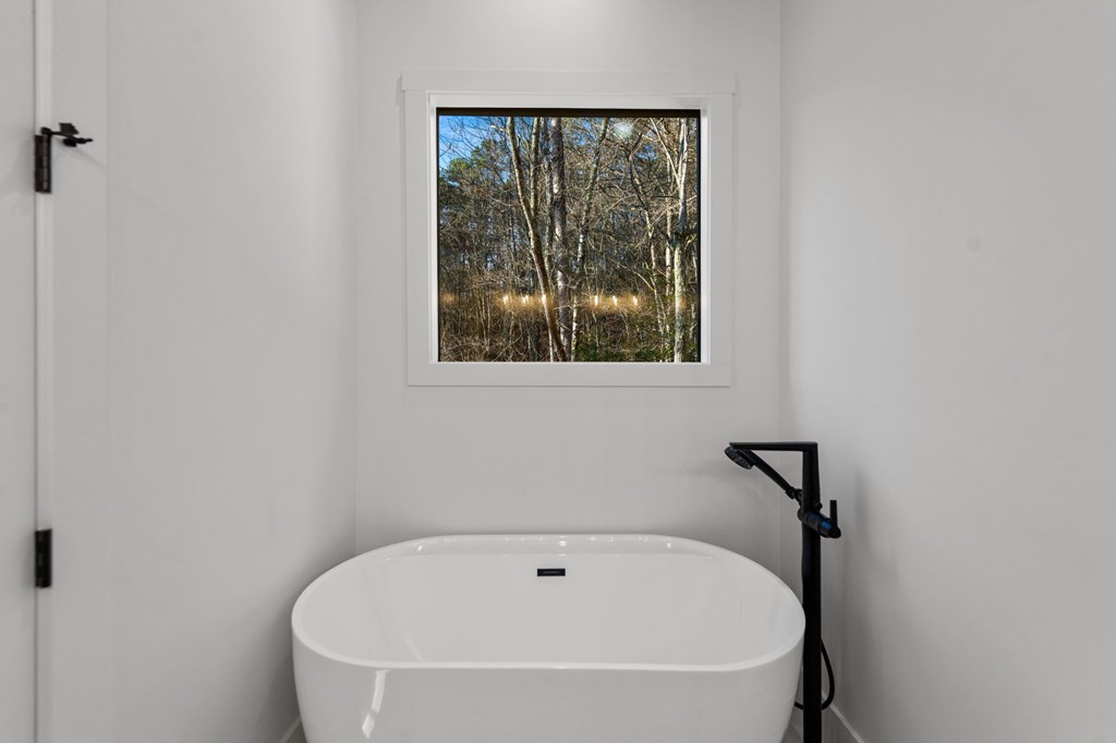770 Fish Hook Point Blue Ridge, GA 30513 - Photo 50 of 96 Owners Bathroom, Soft Close Cabinetry + LED Touch SMART Mirrors + Quartz Countertops + Tile Floor + Free Standing Tub/Filler + Walk In Shower with Dual Rain Shower Heads + Frameless Shower | Vaulted Stained Ceiling