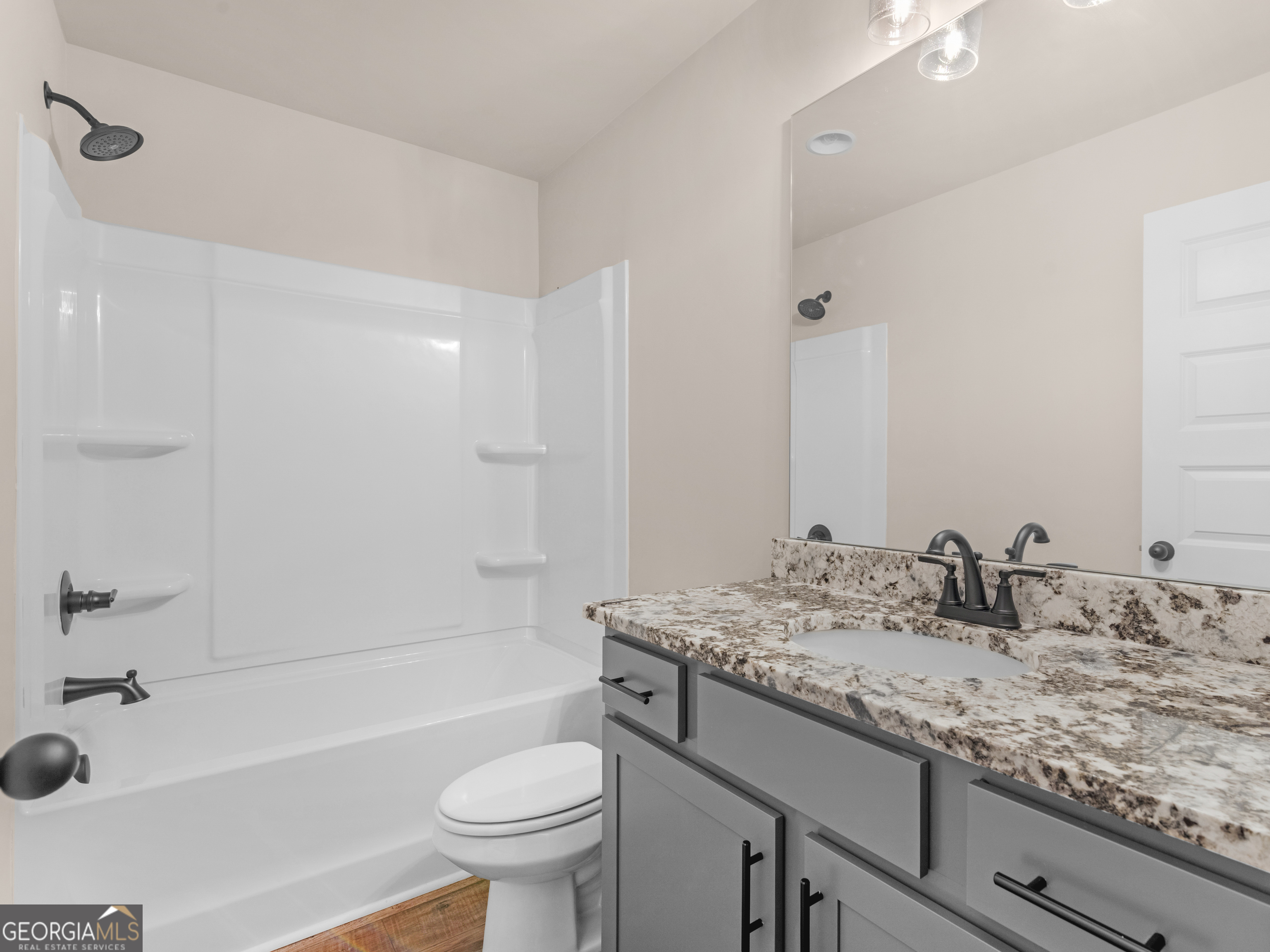 160 Loyd Road Mansfield, GA 30056 - Photo 53 of 53 a bathroom with a granite countertop sink a toilet and bathtub