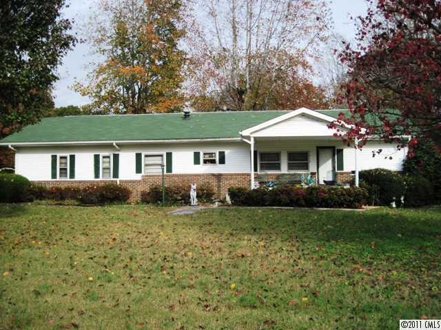 1410 Requa Road Cherryville, NC 28021 - Photo 1 of 16 a front view of a house with a yard