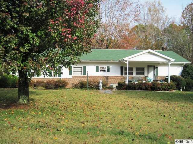 1410 Requa Road Cherryville, NC 28021 - Photo 16 of 16 a front view of a house with a garden