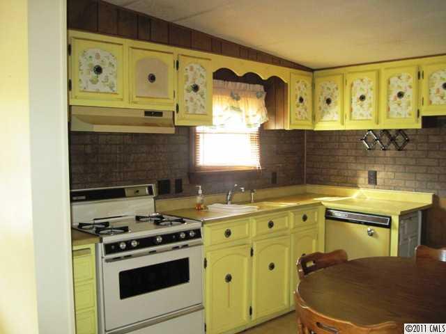 1410 Requa Road Cherryville, NC 28021 - Photo 5 of 16 a kitchen with a stove and a sink