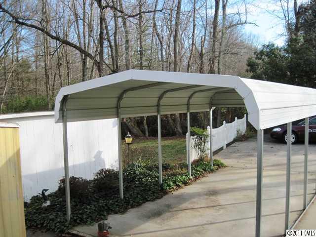 1410 Requa Road Cherryville, NC 28021 - Photo 10 of 16 a side view of a house with backyard and sitting area