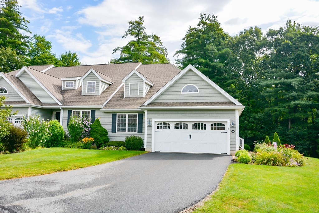 39 Riley Road, Unit 51 Lunenburg, MA 01462 - Photo 1 of 42 a view of house with garden and tall tress
