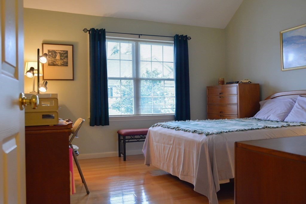 39 Riley Road, Unit 51 Lunenburg, MA 01462 - Photo 18 of 42 a bedroom with a bed and a table chair