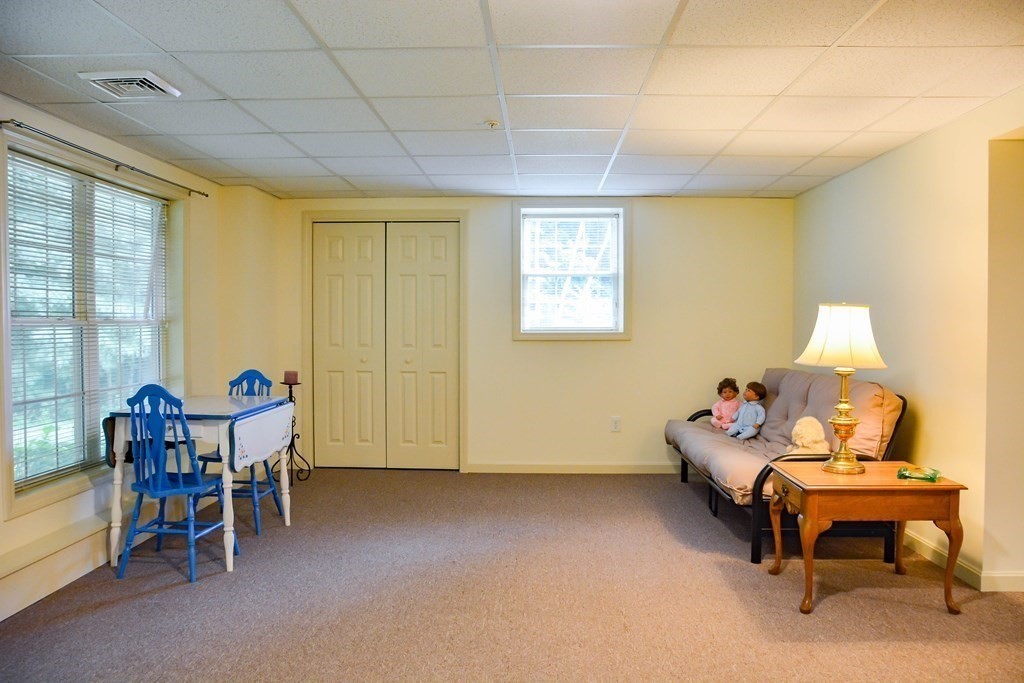 39 Riley Road, Unit 51 Lunenburg, MA 01462 - Photo 23 of 42 a living room with furniture and a table