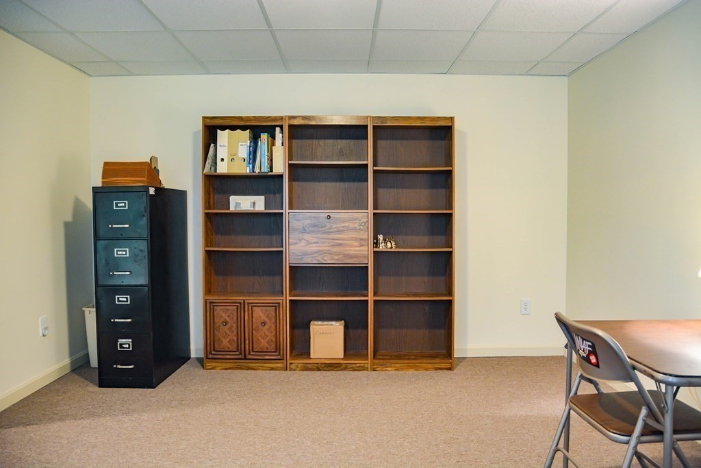 39 Riley Road, Unit 51 Lunenburg, MA 01462 - Photo 26 of 42 a view of an empty room with empty shelves