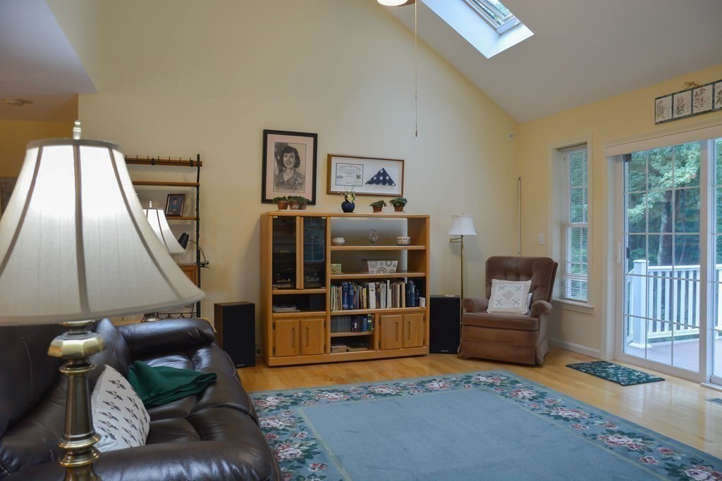 39 Riley Road, Unit 51 Lunenburg, MA 01462 - Photo 4 of 42 a living room with furniture and a floor to ceiling window