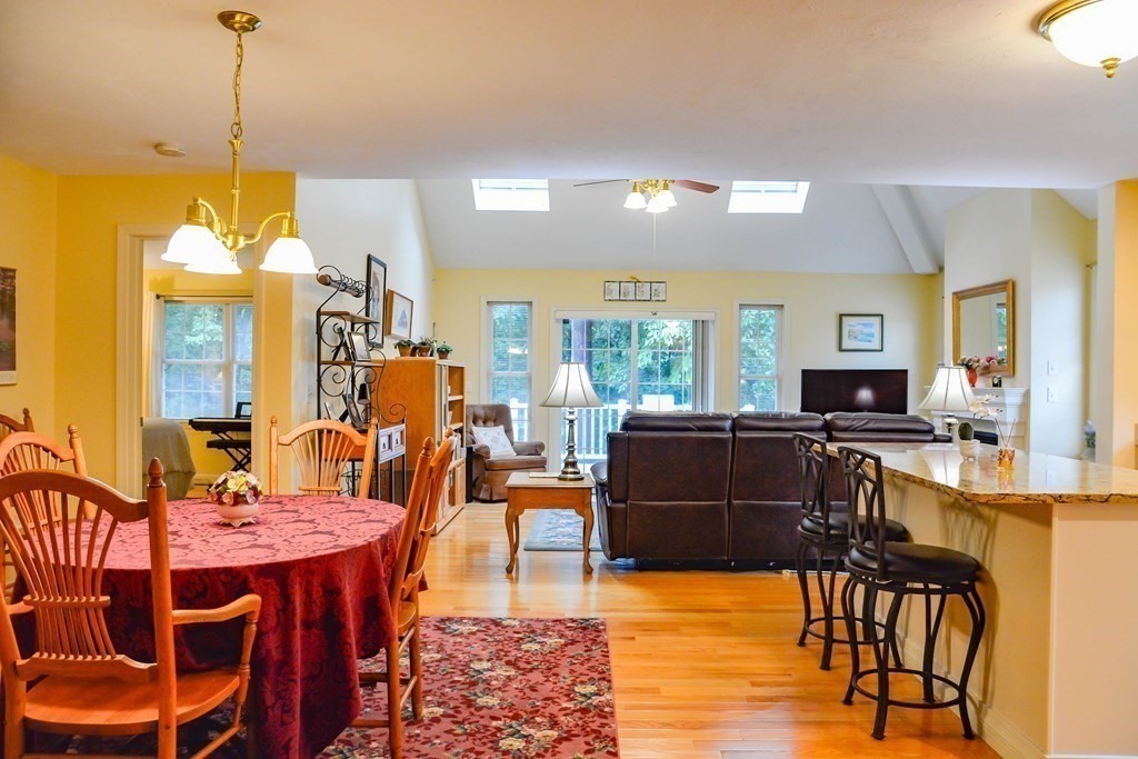 39 Riley Road, Unit 51 Lunenburg, MA 01462 - Photo 8 of 42 a view of a dining room with furniture and a chandelier