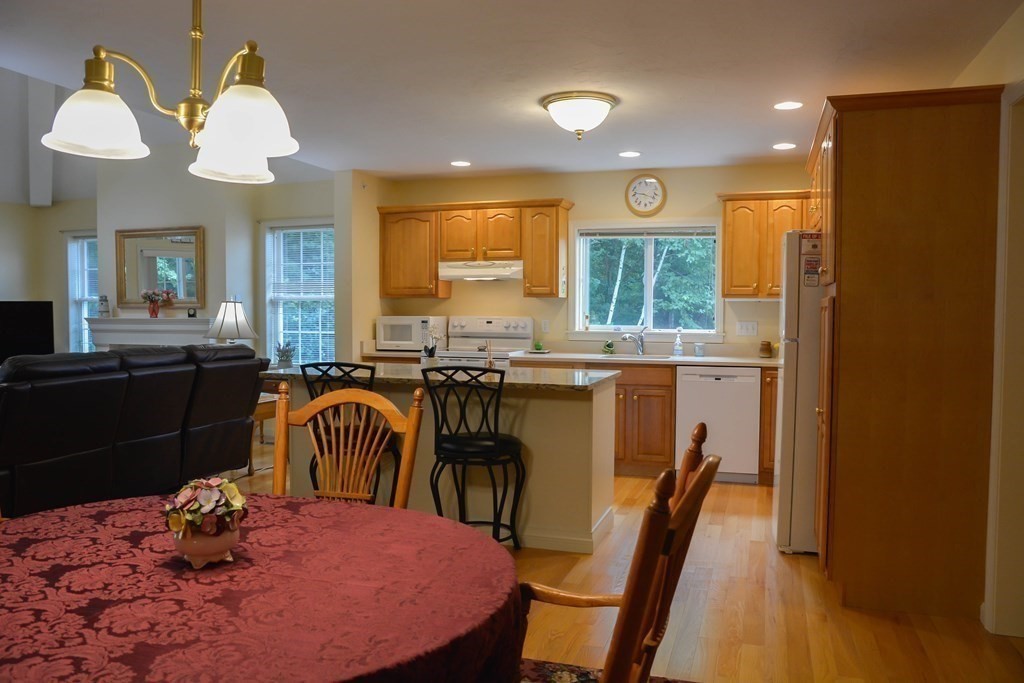 39 Riley Road, Unit 51 Lunenburg, MA 01462 - Photo 9 of 42 a kitchen with a table and chairs