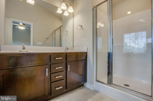 a kitchen with a refrigerator and a sink