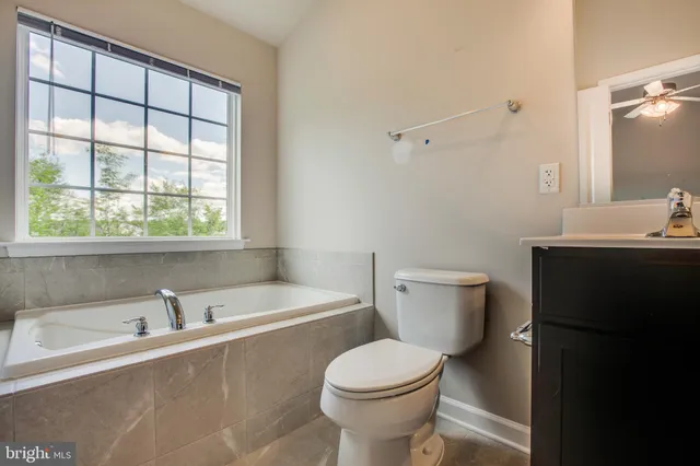 a bathroom with a sink a toilet and a bathtub